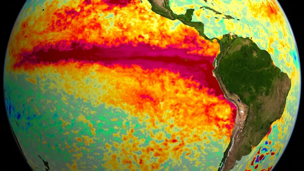 Globo terráqueo con mapa térmico del océano Pacífico que muestra temperaturas elevadas en rojo y amarillo.