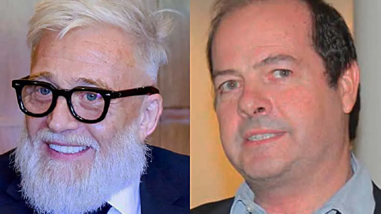 Retrato de dos empresarios en primer plano, uno con barba blanca y gafas y otro con camisa gris.