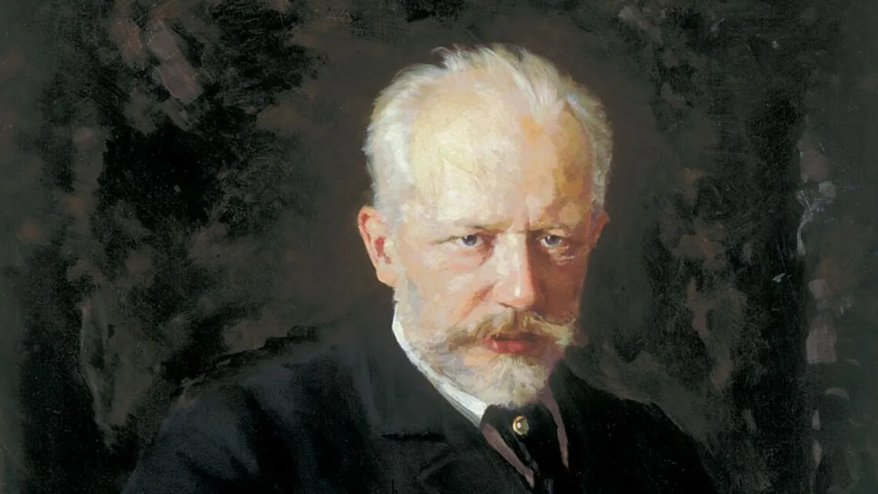 Pintura al óleo con el retrato de Piotr Ilich Chaikovski de cabello canoso y barba sobre fondo oscuro.